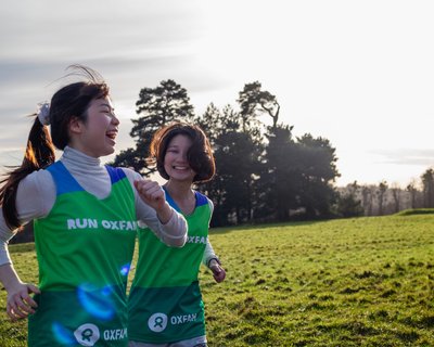 Two People In Oxfam T-Shirts walking in the country side as part of an event